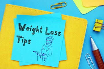 Weight Loss Tips inscription on the piece of paper.