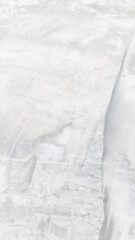 Vintage white old plaster wall background for graphic design or wallpaper Soft concrete floor pattern in retro concept