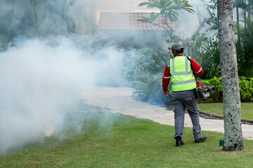 Man use fumigation mosquitoes machine to kill mosquito outside in park or garden. Zika virus and...