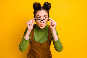 Photo of minded interested girl look copyspace touch spectacles make lips pouted plump wear sweater jumper isolated over vivid color background