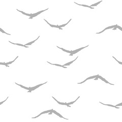 Seamless pattern with grey flying birds