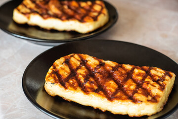 Grilled haloumi cheese on a plate