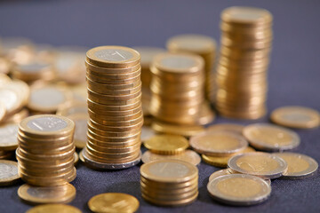 Stock Photo - Euro coins. Euro money. Euro currency.Coins stacked on each other in different positions. Money concept