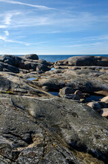 Blue sky, sea, nice cliffs. View of the archipelago in northern Gothenburg. A nice summer day in Sweden. Place for text, copy space.