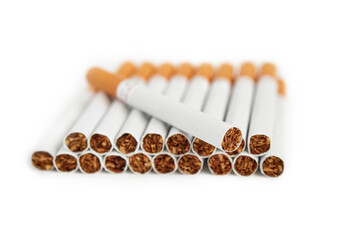 Pile of filter cigarettes on white isolated background