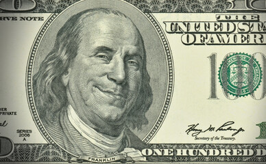 American economy - one hundred dollars banknote with greedy expression