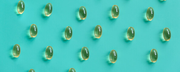 Fish oil capsules on a blue background. Omega-3