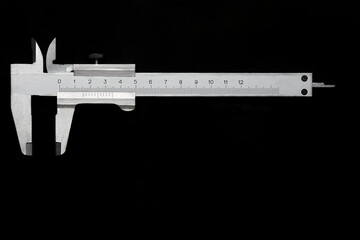 Vernier caliper on a dark  background. Precise measurement concept.