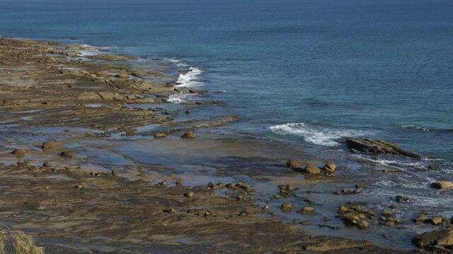 Waves Splashing On The Rocky Shore - Sunset By The Coastal Suburb Of Buddina In Sunshine Coast Region, Queensland, Australia - medium shot