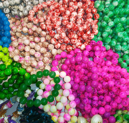 Beautiful jewelry on the background of seashells. beads made of pearls in shop. gift concept abstract photo