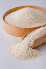 natural organic semolina on white acrylic background