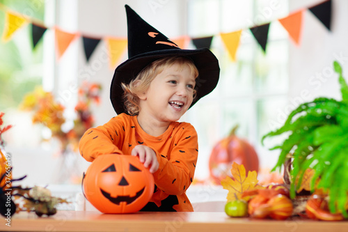 Child in Halloween costume. Kids trick or treat.
