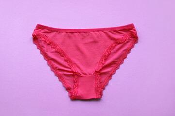 Set of women's panties on a pink background. Pink underwear.