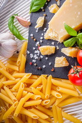 concept of traditional italian pasta with tomatoes and basil