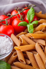 concept of traditional italian pasta with tomatoes and basil