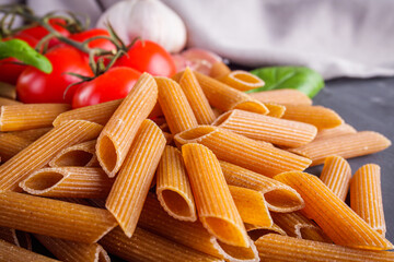 concept of traditional italian pasta with tomatoes and basil