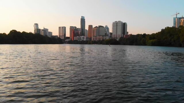 Low drone shot passing a circle boat and approaching the downtown Skyline. Shot in August 2020