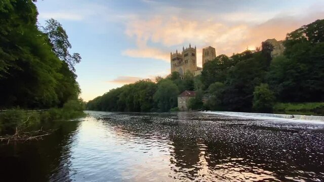 Durham Cathedral next to the River Wear in North-East England at sunrise. Still shot.