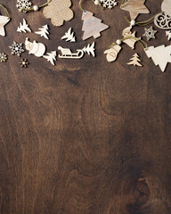Happy New year and merry Christmas. Wooden eco decorations on a brown wooden table. Christmas background