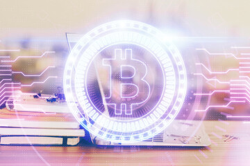 Double exposure of blockchain theme hologram and table with computer background. Concept of bitcoin...