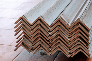 Fototapeta na wymiar Rolled metal, L-profil. Stack of angle steel in the factory.