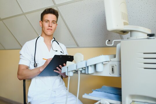 Sonographer Using Modern Ultrasound Machine In Clinic