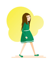 Girl in green dress against the yellow spot, goes