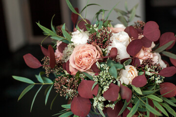 Wedding bouquet of flowers from white red rosebuds