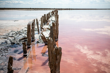 Wooden frame from the salt mining industry. Pink salty lake