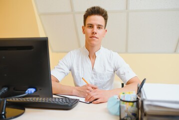 Portrait smiling doctor at office