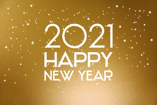2021 Happy New Year starry golden background stock images. 2021 New Year sign on a golden shiny background. Happy New Year 2021 gold greeting card images
