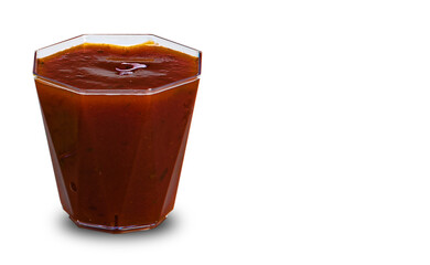 Container with tomato-based ketchup sauce on white background