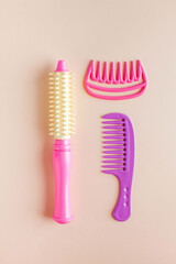 Set of children's toys hair dryer, combs. Concept of toys for girls, hair salon, children's beauty salon.