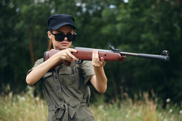 Woman weapons Sunglasses weapon hunting lifestyle green trees 