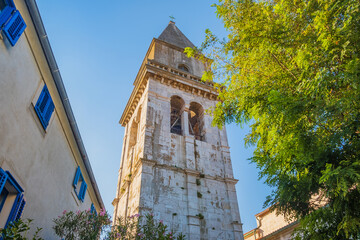 Town of Osor on the island of Cres in Croatia, cathedral tower and cityscape 
