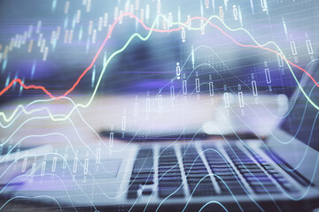 Financial market graph hologram and personal computer on background. Multi exposure. Concept of forex.