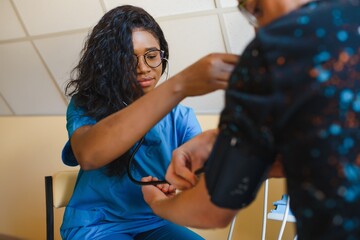 portrait of african female doctor at workplace