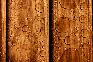 Wood texture with raindrops with "selective focus". Copy space.