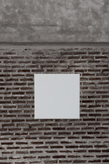 blank white canvas on grey brick wall background