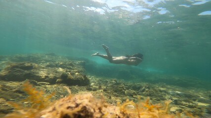 Fototapeta premium young woman snorkelling in costa brava