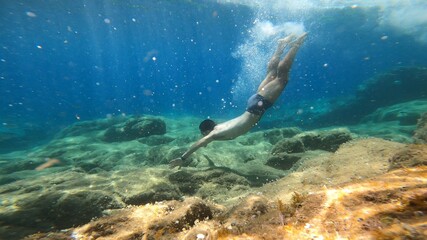young man snorkelling in costa brava