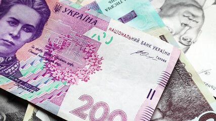 Banknotes of 200 hryvnia. National currency of Ukraine. Cash paper money close up background.