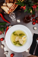 a white bowl filled with Delicious chicken noodle soup