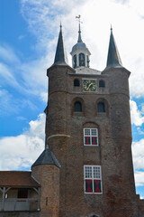 Fototapeta na wymiar Tower with bells from the Zuidhavenpoort city gate in the old town of Zierikzee, Netherlands