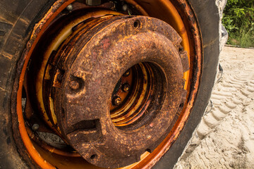 old and rusty tractor standing on the beach