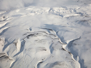 Fototapeta premium aerial view of the mountains in winter