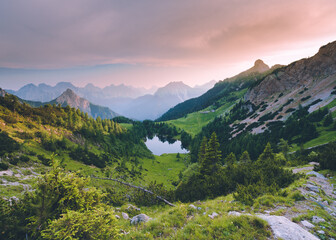 Little mountain lake in the Italian Alps, Lago Bordaglia, Friuli Venezia Giulia, Italy. Alpine forest lake valley 