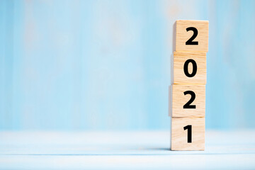 2021 new year wooden cubes on blue table background with copy space for text. Business Goals, Mission, Resolution, New Year New You concept