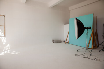 Empty photo studio with lighting equipment