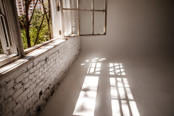 A white loft with a large open window. photographic studio.
